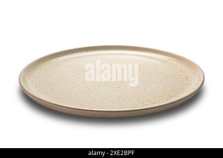 Side view closeup of brown ceramic plate isolated on white background. Stock Photo