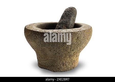 Side view of old rock mortar with pestle isolated on white background. Stock Photo