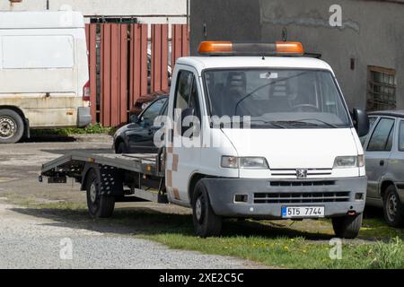 PROSTREDNI SUCHA, CZECH REPUBLIC - APRIL 5, 2024: Peugeot Boxer 230 tow truck on junkyard Stock Photo