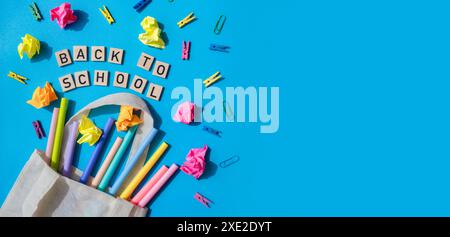 Banner copy space Educational greeting announcement for students and teacher. Saying BACK TO SCHOOL text on wooden blocks on cre Stock Photo