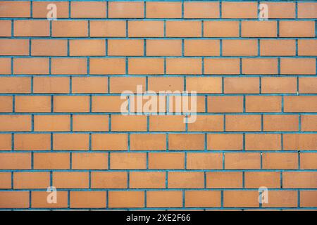 Background from a wall made of orange clinker bricks Stock Photo