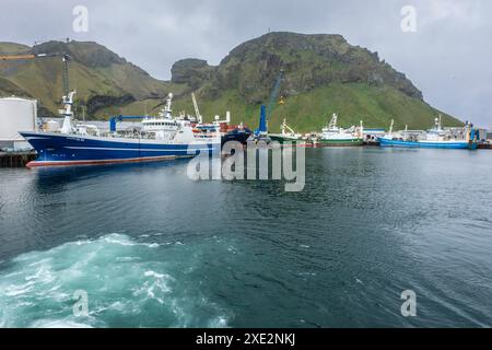 The city of Heimaey and the haven are located at the foot of the ...