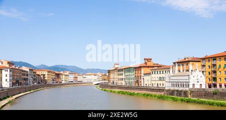 Pisa, Italy - colourful buildings on Arno river. Urban skyline, travel destination. Stock Photo