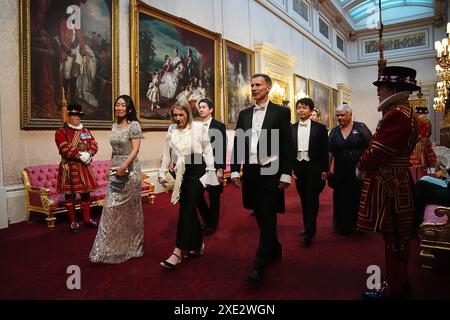 Chancellor of the Exchequer Jeremy Hunt make his way along the East Gallery to attend the State Banquet for Emperor Naruhito and his wife Empress Masako of Japan at Buckingham Palace, London, as part of their state visit to the UK. Picture date: Tuesday June 25, 2024. Stock Photo