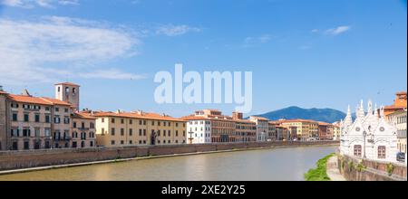 Pisa, Italy - colourful buildings on Arno river. Urban skyline, travel destination. Stock Photo