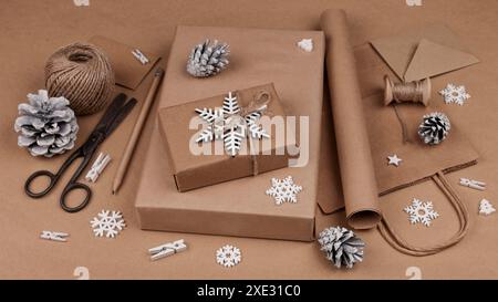 Packing Christmas gifts in brown paper Stock Photo
