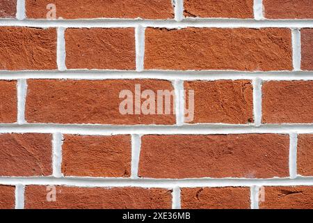 Background from a red brick wall with white joints Stock Photo