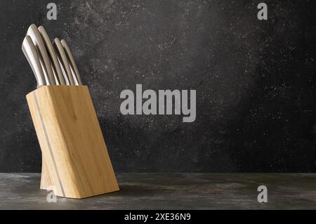 Casting steel various chef knife, Set of modern sharp kitchen knives on dark rustic background Stock Photo