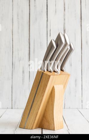 Casting steel various chef knife, Set of modern sharp kitchen knives on white rustic background Stock Photo