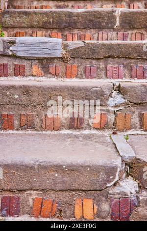 Weathered Brick and Stone Staircase Close-Up with Textured Decay Stock Photo