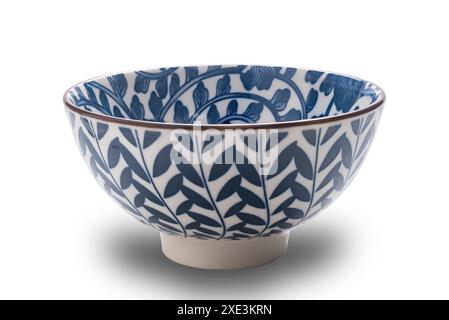 Side view of blue pattern ceramic bowl deep bottom with black edge. Stock Photo