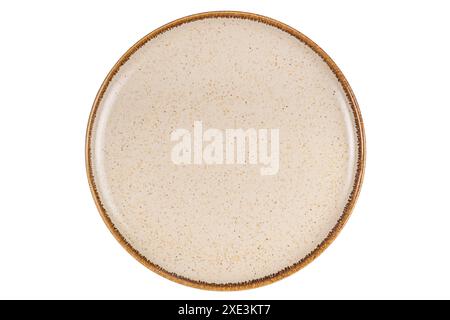 Top view of single empty round spotted brown ceramic plate with brown edge. Stock Photo