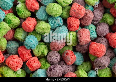 Background of Red Purple Green and Blue Berry Flavored Kids Cereal Stock Photo
