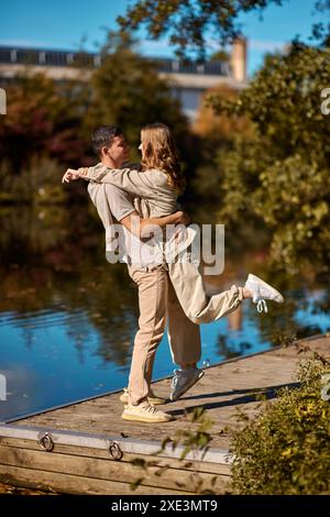 Couple hugging at riverside Stock Photo - Alamy
