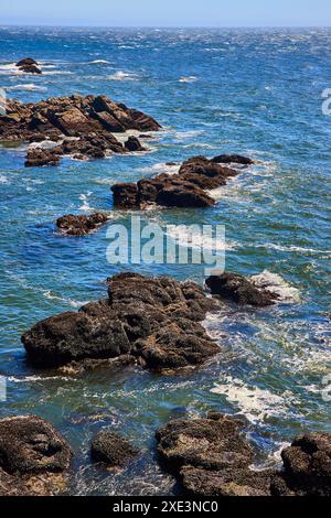 The aerial view of the waves crashing into the rocky shore of Sri Lanka ...