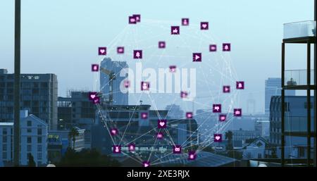 Image of globe of digital icons spinning against aerial view of cityscape Stock Photo