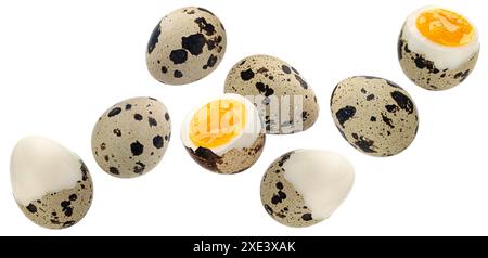 Falling quail eggs isolated on white background Stock Photo