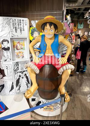 Kita Ward, Osaka, Japan. Dec 24, 2023. A Human Size Model of Monkey D. Luffy from a Japanese Animation One Piece a comic cartoon Stock Photo