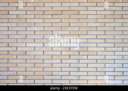 Background from a beige clinkered wall Stock Photo