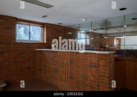A brick basement bar inside a house. The house has been demolished Stock Photo