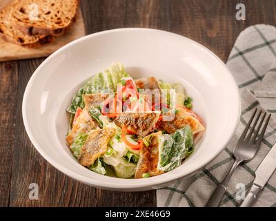 Delicious salad with fried baked smelt fish Stock Photo