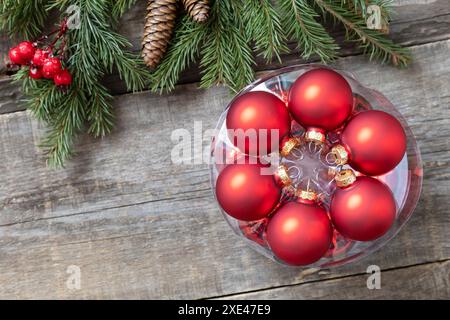 Holiday Xmas concept. Christmas red balls on a rustic wooden background. Top view flat lay. Copy space. Stock Photo