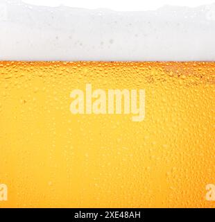 Close up background of beer with bubbles in glass Stock Photo