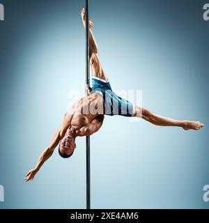 Man pole dancing Stock Photo