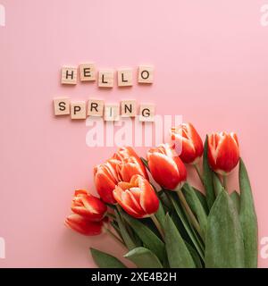 Hello spring concept. Tulip on pink background Stock Photo