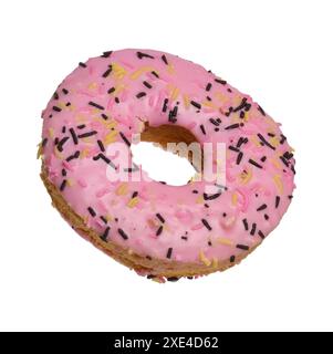 Donut covered with pink glaze and sprinkled with colorful sprinkles on isolated background Stock Photo