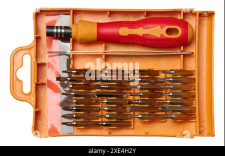 Plastic box with screwdriver and various bits for screws on isolated background Stock Photo