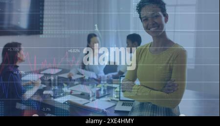 Image of binary codes, computer language and graphs, biracial woman standing arms crossed Stock Photo