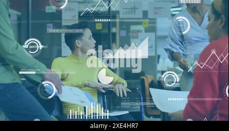 Image of multiple graphs, loading bars, circles, diverse coworkers discussing reports in office Stock Photo