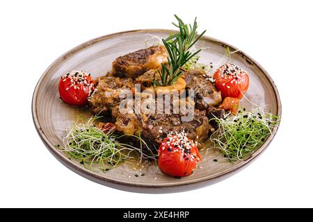 Grilled bbq steaks with fresh herbs and tomatoes Stock Photo