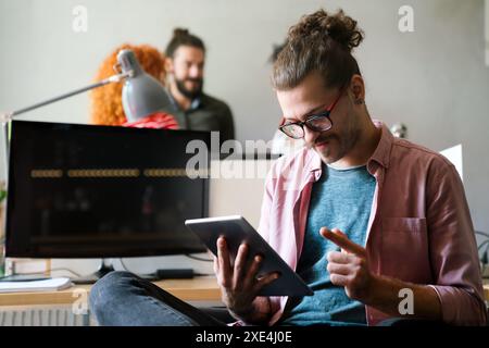 Software, coding and business woman on tablet thinking of data analytics, digital technology. Stock Photo