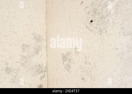 Grunge background texture of an old white plaster wall. Full frame Stock Photo