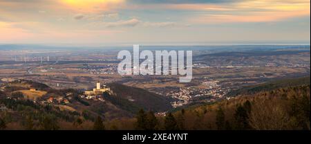 The medieval Forchtenstein Castle on the hilltop surrounded by dense forest below and view up to lake neusiedlersee Stock Photo