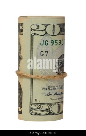 Rolled American dollar twenty dollar bills on isolated background Stock Photo