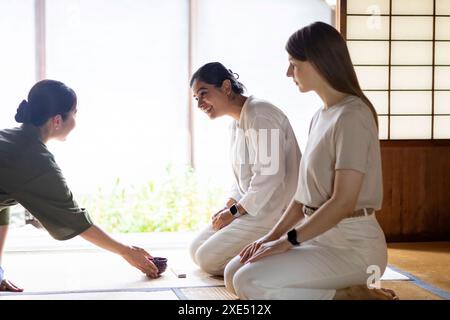 Foreigner receiving matcha tea Stock Photo