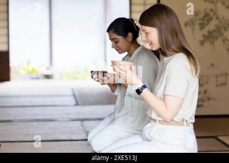 Foreigner receiving matcha tea Stock Photo