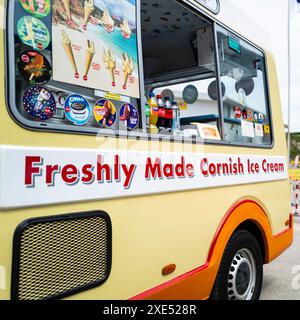 Freshly made Cornish ice cream message advertised on the side of an ice cream van truck vehicle parked in Newquay in Cornwall in the UK. Stock Photo