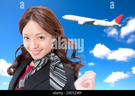 Cabin attendant and plane Stock Photo