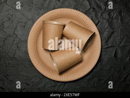 Disposable brown paper plate and coffee cups Stock Photo