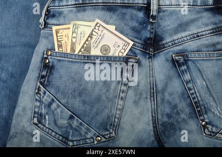US dollar banknotes in jeans back pocket Stock Photo