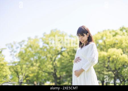 Clip art of pregnant woman who puts her hand on her stomach Stock Photo