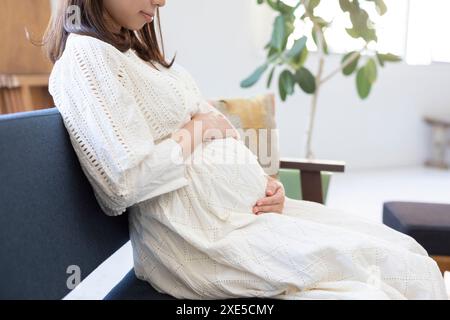 Clip art of pregnant woman who puts her hand on her stomach Stock Photo