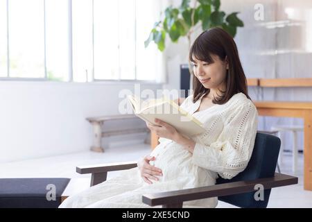 Clip art of pregnant woman who puts her hand on her stomach Stock Photo