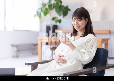 Clip art of pregnant woman who puts her hand on her stomach Stock Photo