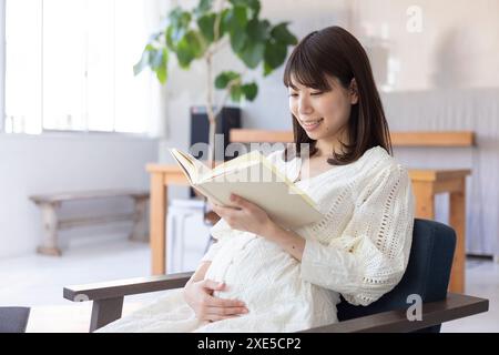 Clip art of pregnant woman who puts her hand on her stomach Stock Photo