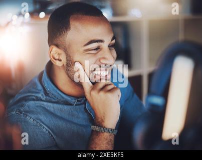 Black man, home and happy on computer for remote work as IT specialist or consultant and freelancer. Employee, business and smile or proud with Stock Photo